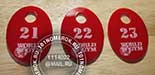 Номерки (бирки) для ключей в фитнесклуб WORLD GYM №39. Номерки из красного акрила. Нанесение логотипа и номера гравировкой.
