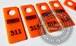 Номерки для гардероба №8. Материал - оранжевый литой акрил 3 мм. Нанесение гравировка с контрастной черной прокраской.