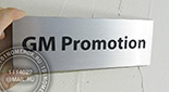 Таблички для дверей в офис "GM PROMOTION" №25. Материал таблички - композитный пластик под структурное серебро. Размер таблички 10х30 см.