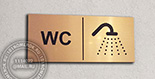 Табличка "WC" №40. Материал таблички - композитный пластик под матовое золото 10х30 см. На одной табличке можно объединить текст и разные пиктограммы.
